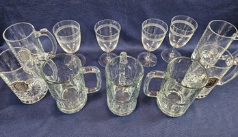 4 Etched Wine Glasses And Seven Mugs