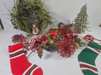 Beautiful Wreath And Other Red And Green Decorations Including Stockings