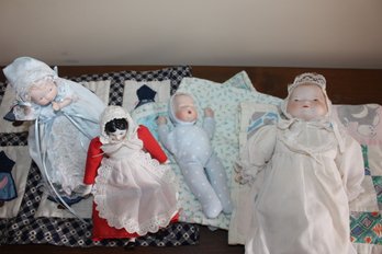 4 Small Dolls With Porcelain Heads Hands And Feet, Except Baby And She Has A Weighted Body