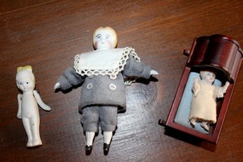 3 Very Small Porcelain Dolls, One In Cradle