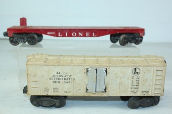 Lionel Automated Refrigerated Milk Car And Black Flatbed Car