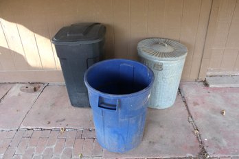 Three Outdoor Trash Cans One Has No Lid