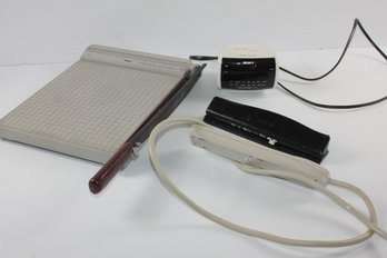 Paper Cutter, Sony Clock Radio, Hole Punch And Extension Cord