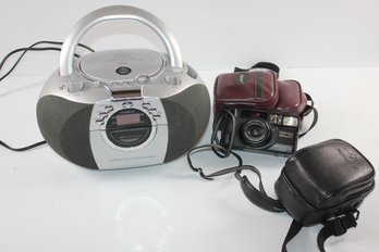 CD Player, Older Film Camera And Two Camera Bags