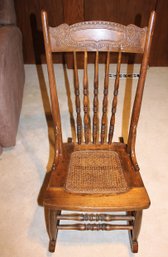 Small Wooden Antique Rocking Chair With Cane Bottom 16-in Wide