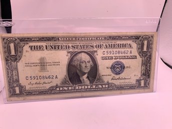 1957 Silver Certificate Dollar Bill In Plastic Sleeve