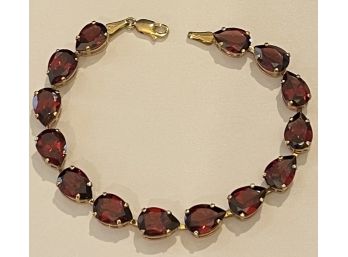 Lovely 10 Karat Yellow Gold And Large Garnet Bracelet