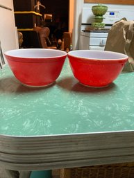 Two Red Pyrex Bowls