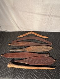 Group Of Tribal Boomerangs And Carvings