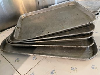 Stack Of Baking Sheet In 2-3 Sizes.