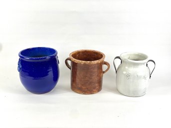 There Pieces Of Colorful Pottery