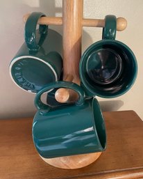 Set Of Four Green Mugs On  Tree