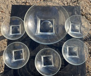 A Glass Salad Bowl With Five Serving Bowls