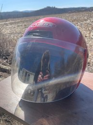 A Red Max Motorcycle Helmet