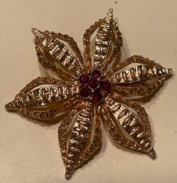 Gold Tone Flower Brooch With Garnet Colored Stone