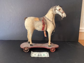 A WonderfulA Wonderful Antique Horse On Wheels!