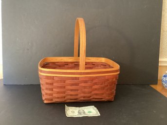 A  Lovely Woven Basket With Handle By The Cherry Company