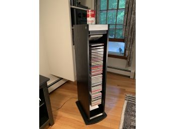 Electronic Brookstone Rotating CD Storage Rack Complete With CDs.