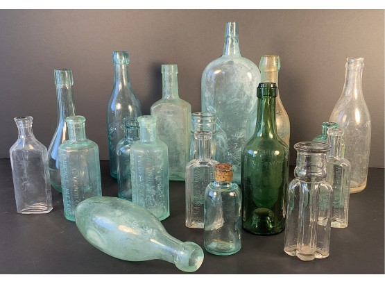 18 Vintage/antique  Glass Bottles In Clear Glass, Aqua Tint Glass And Green Glass