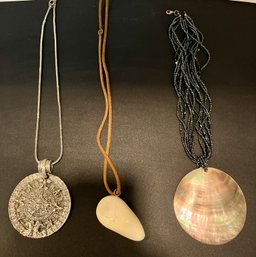 Three Ways To Make A Statement---a Silver Metal Aztec Design--An Abalone Shell--A Smooth Stone With Leather