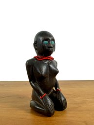 A Kneeling Ironwood Sculpture