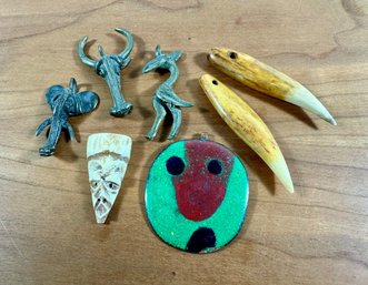 A Grouping Of African Tribe Pendants