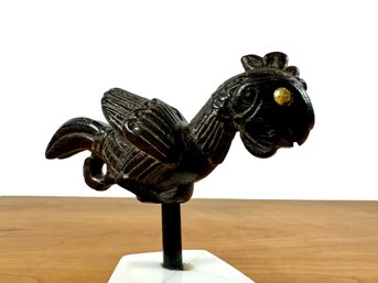 A Carved Ironwood Bird Sculpture Mounted On Stone