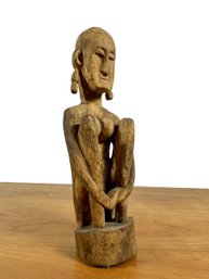 A Carved Figure Sitting - Dogon