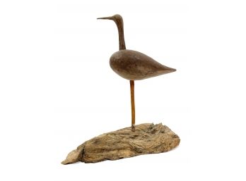 Wooden Bird Sculpture On Driftwood