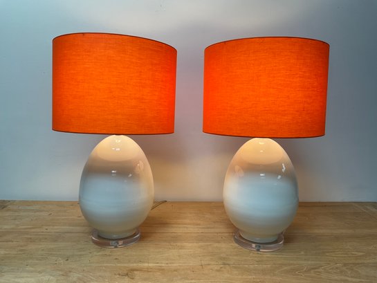 Pair White Lamps With Bright Orange Barrel Shades
