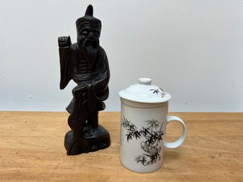 Wooden Asian Figure And An Asian Steeping Tea Mug