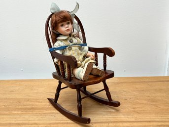 Bisque Doll In Wooden Rocking Chair