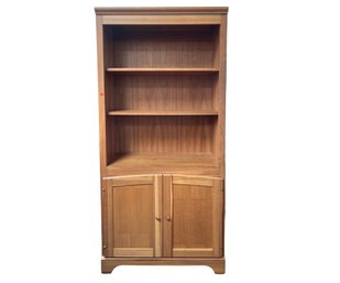 Sturdy Wooden Bookcase Three Shelves And Double Cabinet Doors Below 1 Of 3
