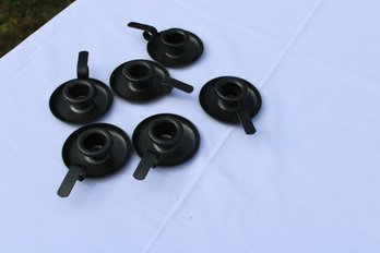 COLLECTION OF METAL FINGER CANDLESTICK HOLDERS