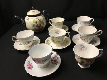 Tea Cups , Saucers And Tea Pot