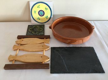 Four Trivets And Glazed Clay Baking Dish