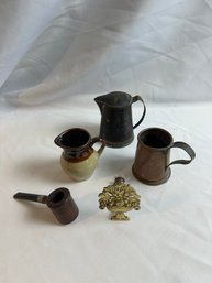 Metal, Pottery And A Pipe