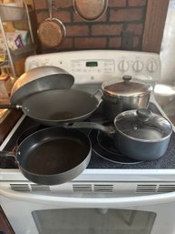 Pots/pans And A Wok With Lid.