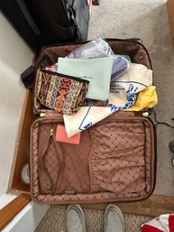 Suitcase Filled With Bags And Travel Containers