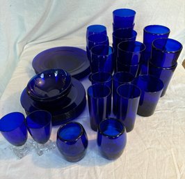 Blue Glass Set 4 Dinner Plates,, 2 Bowls, 7 Small Plates, 3 Goblets, 18 Drinking Glasses, 2 Votive Holders(SR)