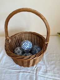 Five Porcelain Balls And A Basket