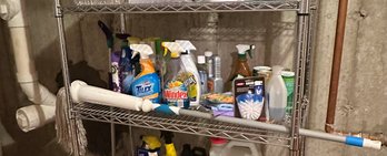 Shelf Of Cleaning Products And A Mop