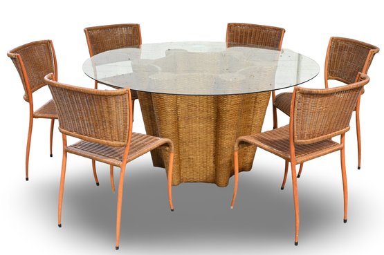 LARGE INDOOR DINING TABLE W/ROUND GLASS TOP AND WICKER BASE AND 6 MATCHING CHAIRS