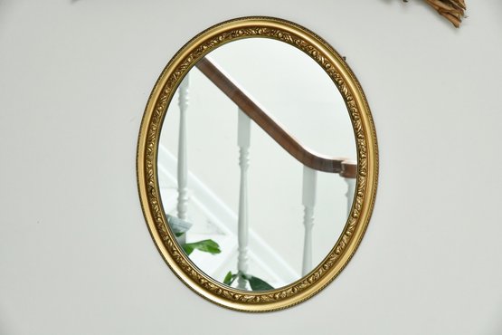 Lovely Gold Oval Wall Mirror And Swag