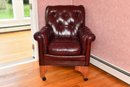 Oxblood Button Tufted Armchair On Wheels With Footrest