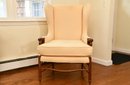 Custom Upholstered Buttermilk Yellow Wingback Armchair With Fluted Legs