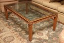 Carved Wooden Coffee Table With Glass Top