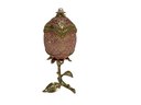 Pink And Gold Faberge Egg On Leaf Stand