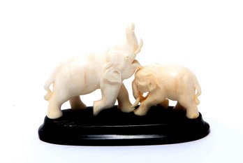 Carved Bone Elephants On Wood Base