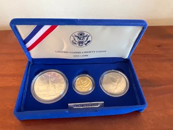 US Liberty Coin 1986 Gold Five Dollar, Half Dollar & Silver Dollar